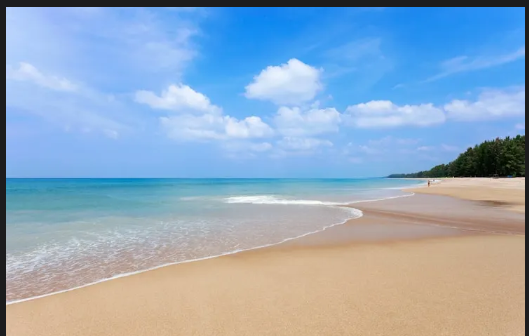 Sunset view at Bali Beach with golden sky reflection
